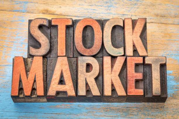 istock stock market text in wood type 667544840