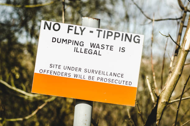 warning fly tipping sign stock photo