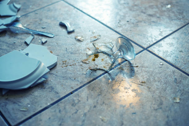 close up on broken dishes on the floor