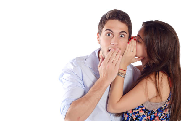 istock Woman whispering secret. 667563928