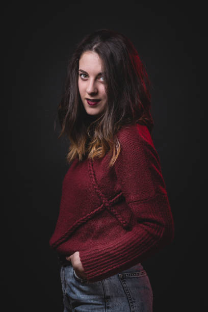 istock Attractive woman on red. 667563978
