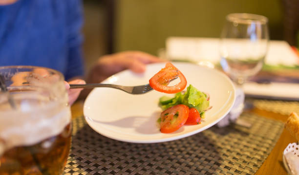 istock Dish with tomatoes and cucumbers in a restaurant 667568910