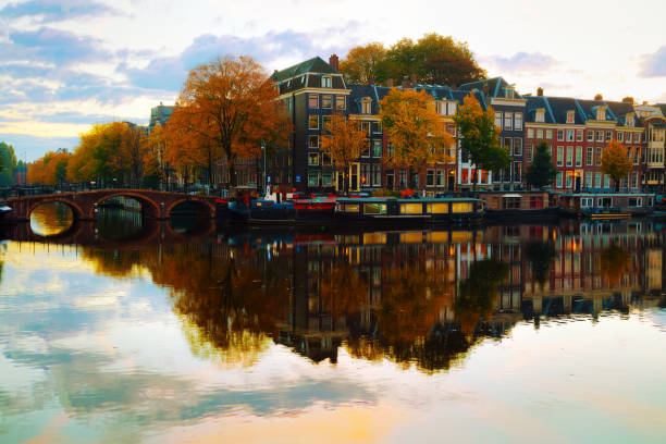 istock Amsterdam city view with canals 667571900