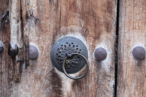 Metal Doorknob on Wooden and Old Door