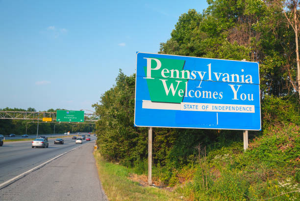 Pennsylvania Welcomes You road sign Pennsylvania Welcomes You road sign at the state border pennsylvania stock pictures, royalty-free photos & images