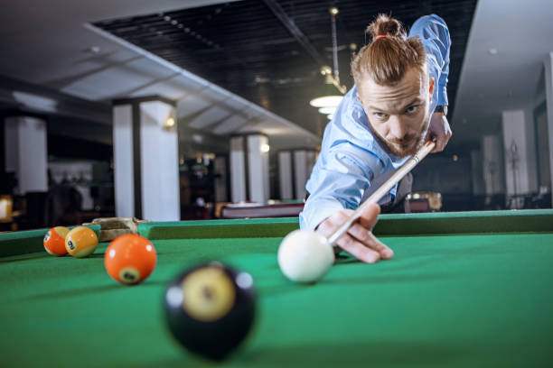 istock Young man is preparing to hit the ball 667581614