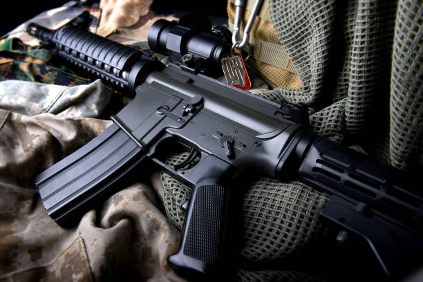 American machine gun in army background style photo with low lighting and dark shadow concept.American machine gun in army background style photo with low lighting and dark shadow concept.