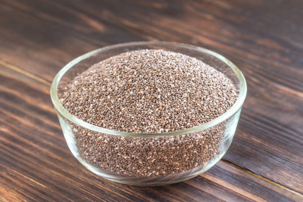 istock Glass bowl of chia seeds 667588530