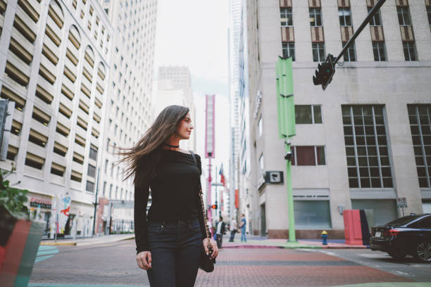 istock girl walks down the street 667590392