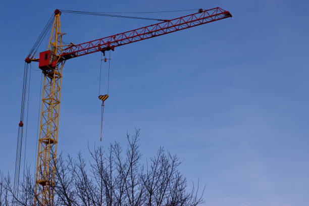 istock A crane against the background of a spring blue sky. 667591326
