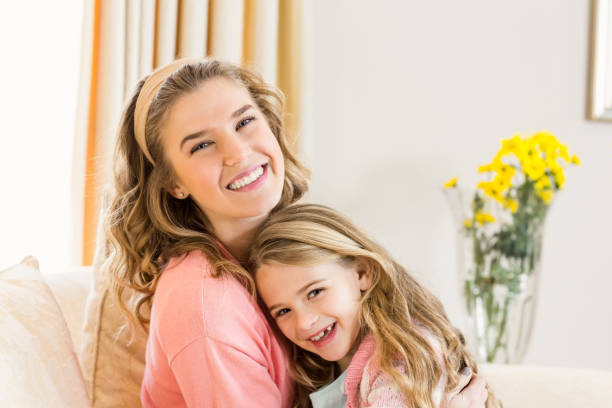 istock Mother and daughter smiling together 667592188