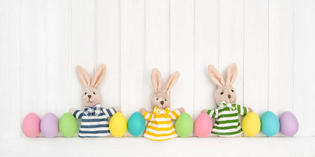 istock Easter decoration eggs funny bunny wooden background 667593064