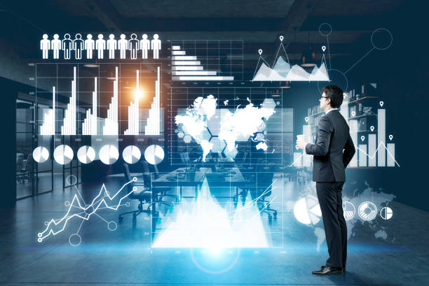 istock Man with coffee and graphs on glassboard 667596080