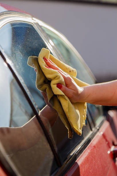 Car care - clean windows Window is being cleaned wachs stock pictures, royalty-free photos & images