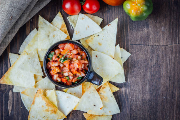 istock Hot mexican salsa - spicy dip with nachos - chips from corn 667599742