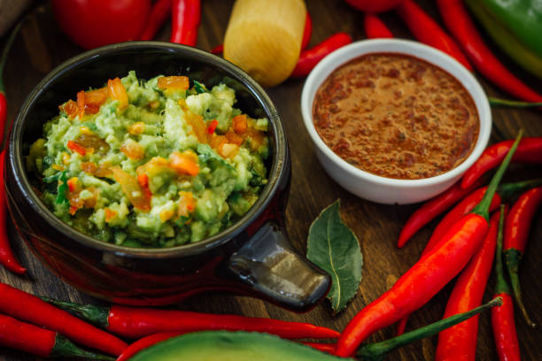 istock Guacamole and salsa - two hot mexican vegetarian dips. 667599748