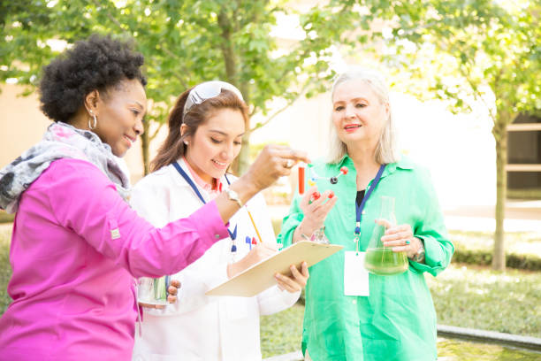 istock STEM themes with female scientists working on water project outdoors. 667607106
