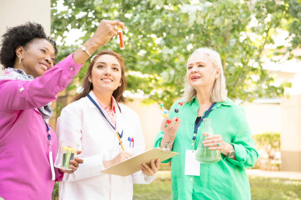 istock STEM themes with female scientists working on water project outdoors. 667610796