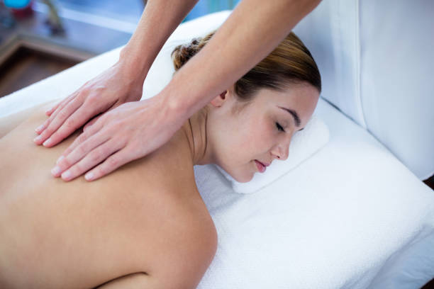 istock Woman receiving a back massage 667624622