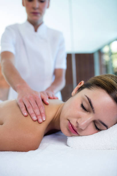 istock Woman receiving a back massage 667624822