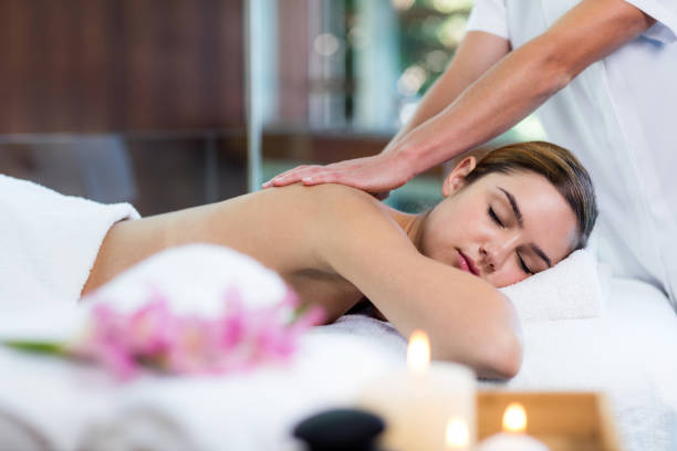 istock Woman receiving a back massage 667625384