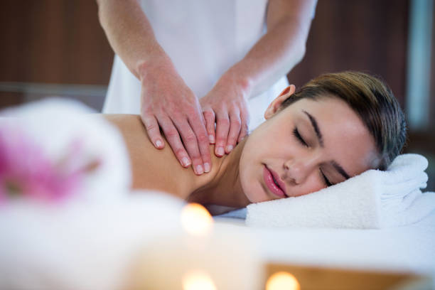 istock Woman receiving a back massage 667625536