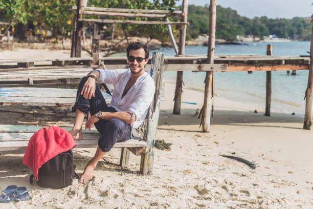 istock Man relaxing by the sea 667632300