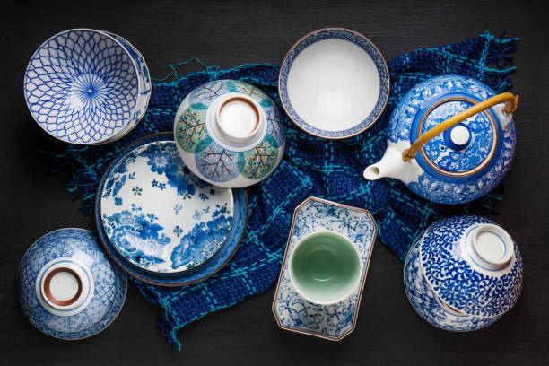 istock Ceramic utensils, bowl plate and teapot on table. Top view 667633508