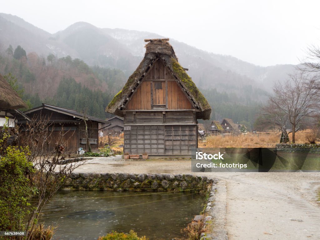 Traditional and Historical Japanese village Shirakawago, Japan - December 22, 2016 : The view of Traditional Japanese village Shirakawago in autumn season, The unique farmhouse called "Gassho" is world heritage of Japan Ancient Stock Photo