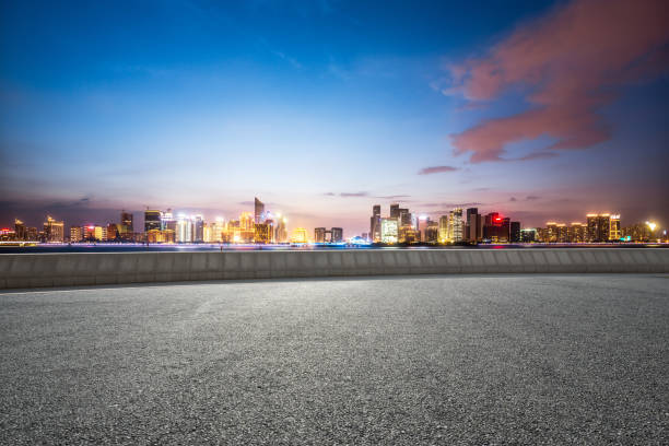 istock empty road with cityscape of modern city 667645058