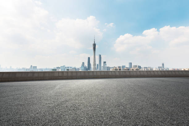 istock empty road with cityscape of modern city 667645726