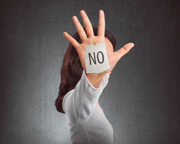 istock Side view of asian woman showing NO note on her hand 667648806