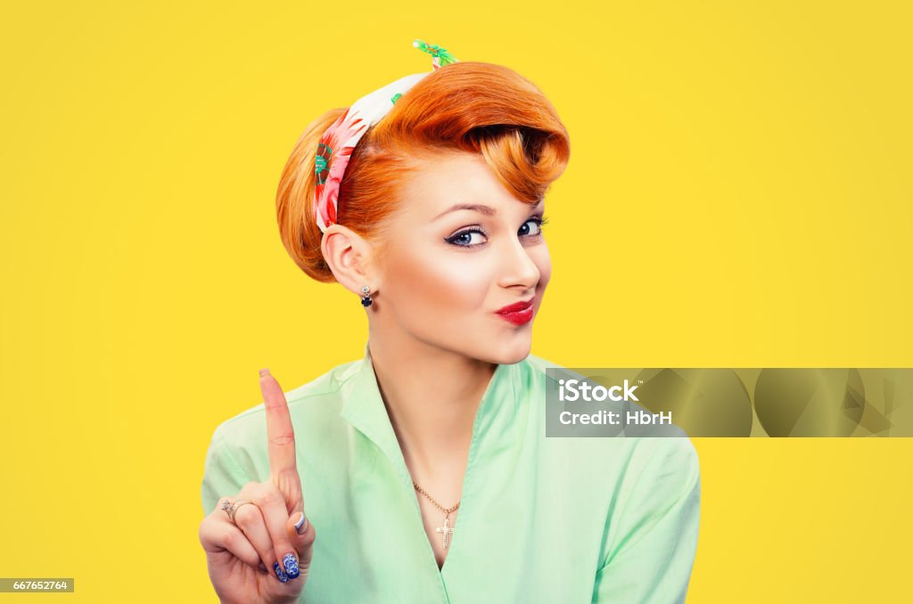 woman gesturing a no sign. Closeup portrait unhappy, serious pinup retro style girl raising finger up saying oh no you did not do that yellow background. Negative emotions facial expressions, feelings Pin-Up Girl Stock Photo