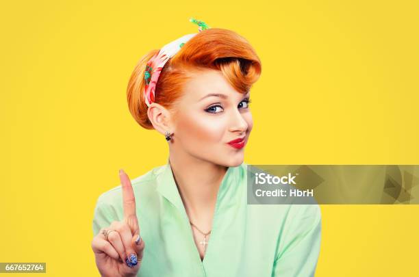 Woman Gesturing A No Sign Closeup Portrait Unhappy Serious Pinup Retro Style Girl Raising Finger Up Saying Oh No You Did Not Do That Yellow Background Negative Emotions Facial Expressions Feelings Stock Photo - Download Image Now