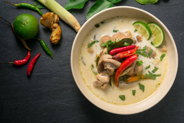 istock Chicken coconut soup (Tom Kha Gai), Thai food on black stone table background 667656538