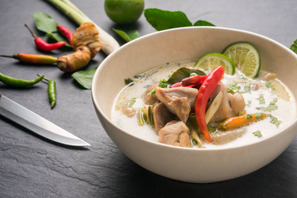 istock Chicken coconut soup (Tom Kha Gai), Thai food on black stone table background 667656630