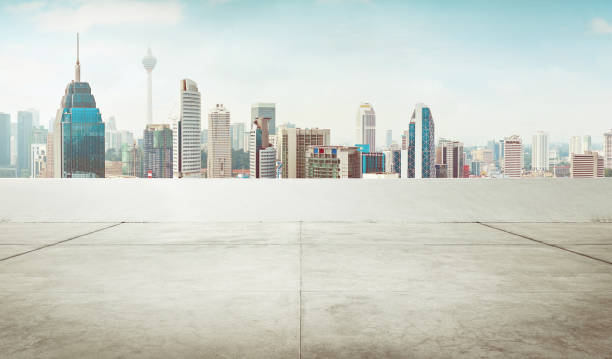 istock Empty roof top carpark with modern city skyline 667657464
