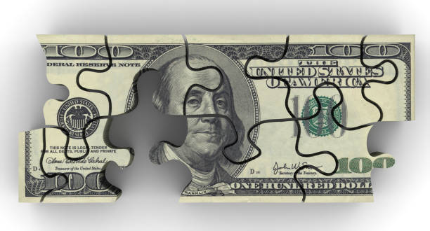 istock Pack of US banknotes in the form of a puzzle 667657936