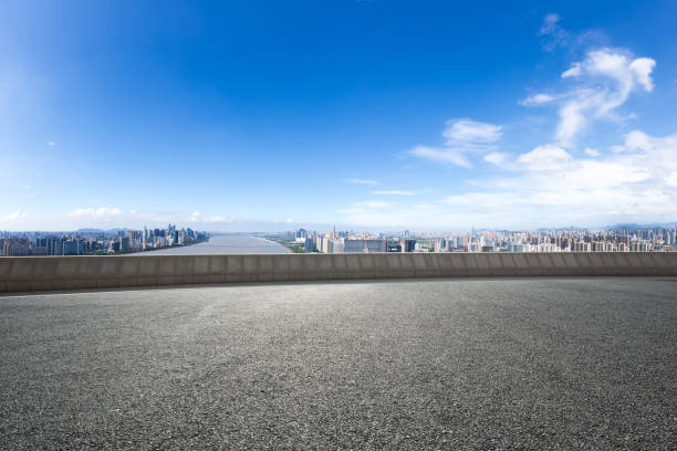 istock empty road with cityscape of modern city 667661516