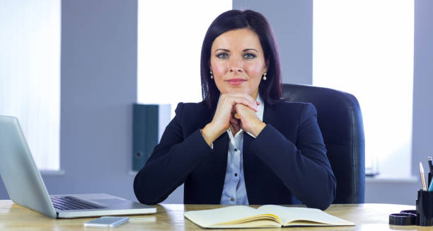 istock Confident businesswoman smiling at camera 667671210