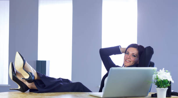 istock Businesswoman relaxing at her desk 667671504