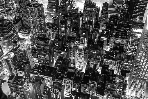 Black and white New York city night scene from Empire State Building.