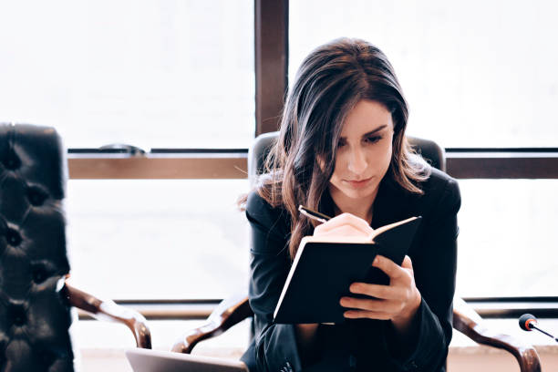 istock Young business woman at work 667678736
