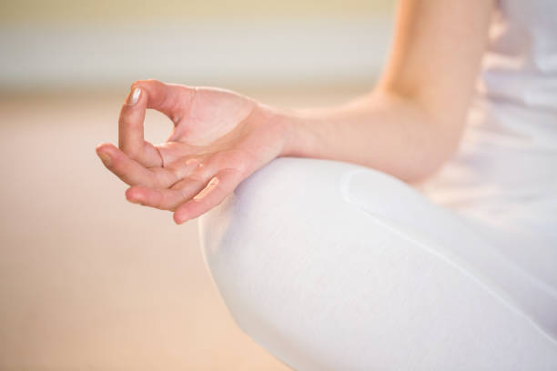 istock Mid section of woman in yoga pose 667679302