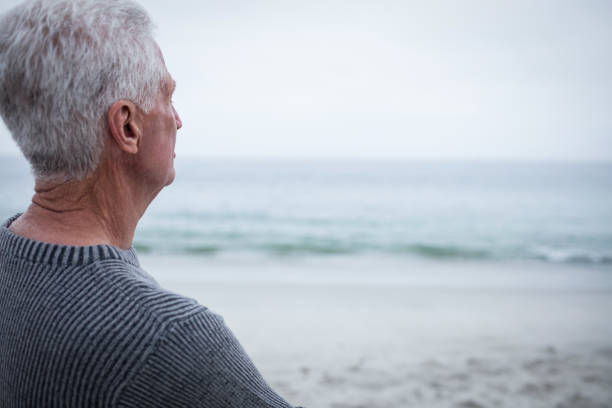 istock Senior man looking at sea 667682324