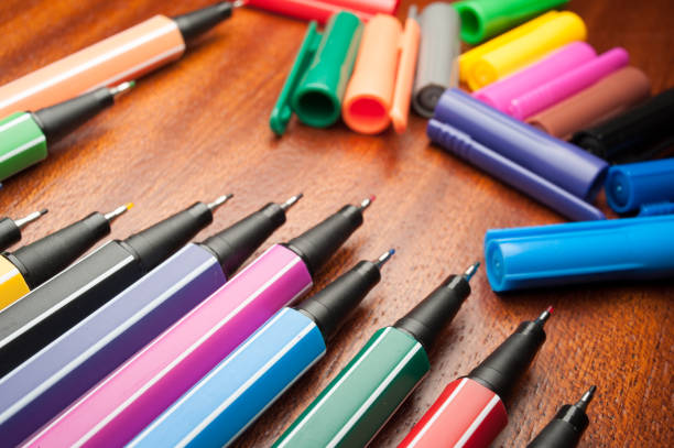 istock Colored marker pens on wood background. 667682476