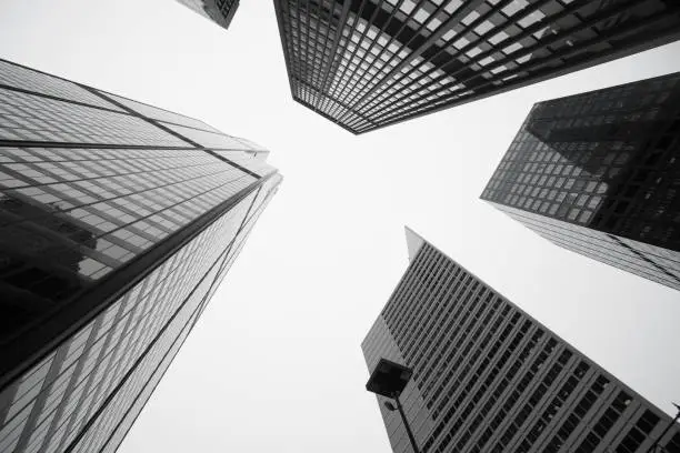 Black and white image towering Architecture and cityscapes of  five Chicago buildings rising skyward Illinois USA
