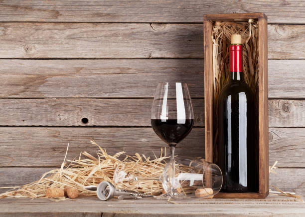 istock Red wine bottle and wine glasses 667685408