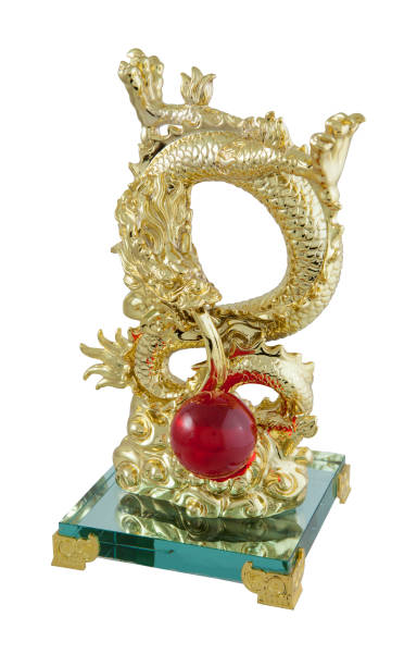 istock Golden dragon statue isolated on white background 667686622