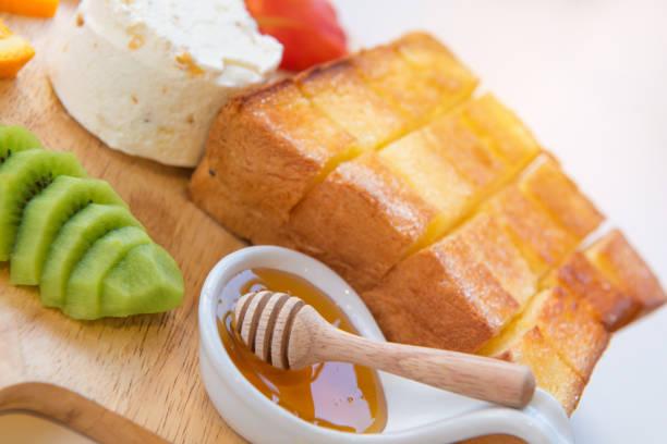 honey toast and ice cream with Mixed Fruit on bread
